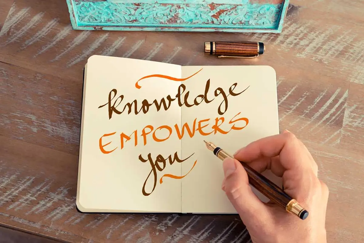 knowledge empowers you text written on a notebook