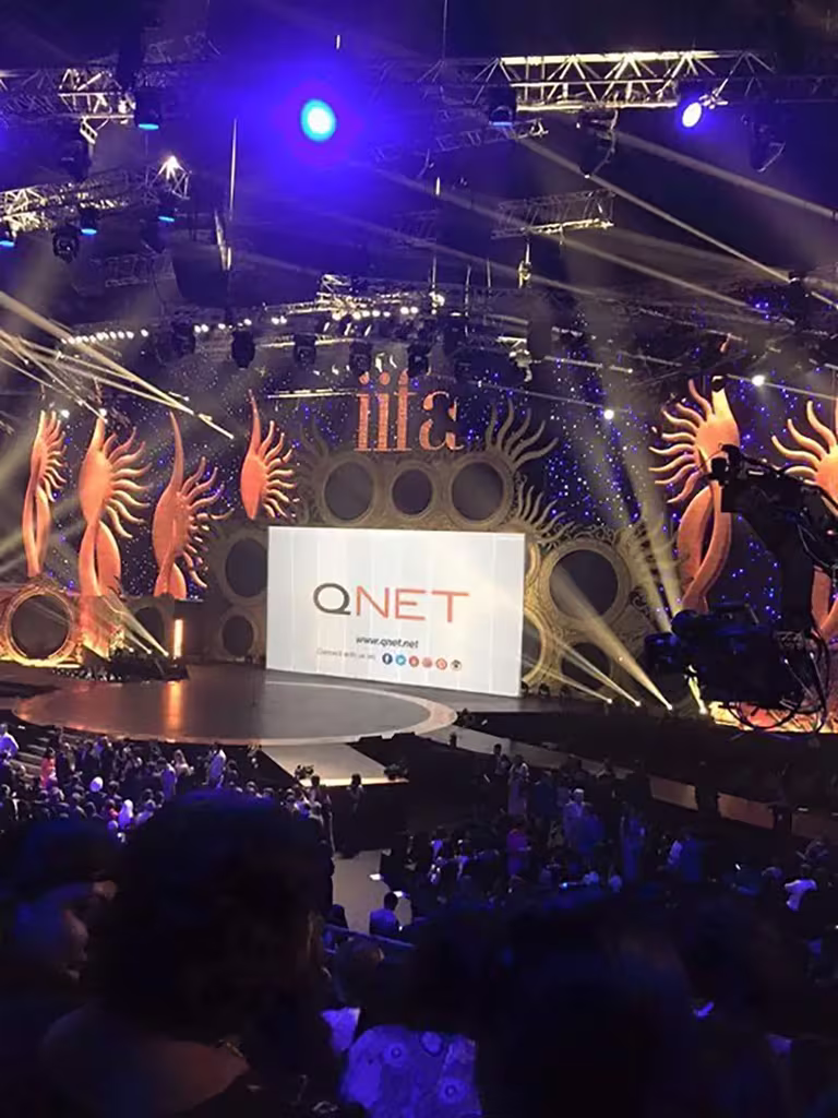 Unforgettable Defining Moments In Qnet History 20 QNET backdrop at the IIFA awards 2015
