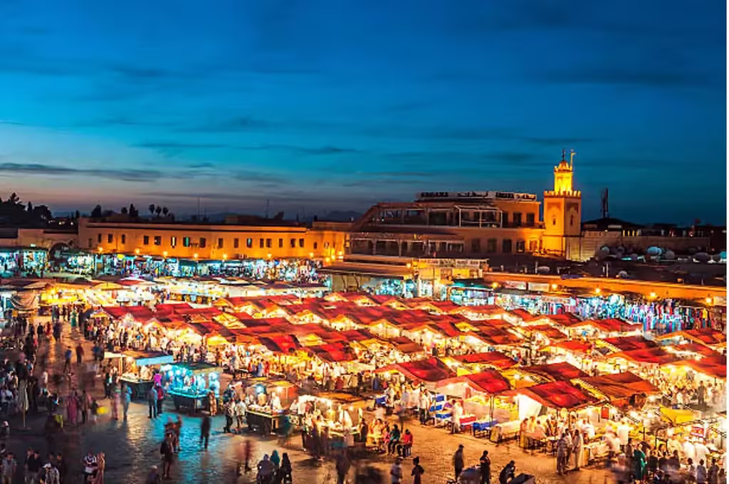 7 Best Budget-Friendly Holiday Destinations To Escape The Winter Season 6 Djemaa El Fna Square at dusk with Koutoubia Mosque, Marrakesh, Morocco