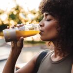 Woman drinking EDG3 Plus which provides the amino acids needed to produce glutathione for immunity