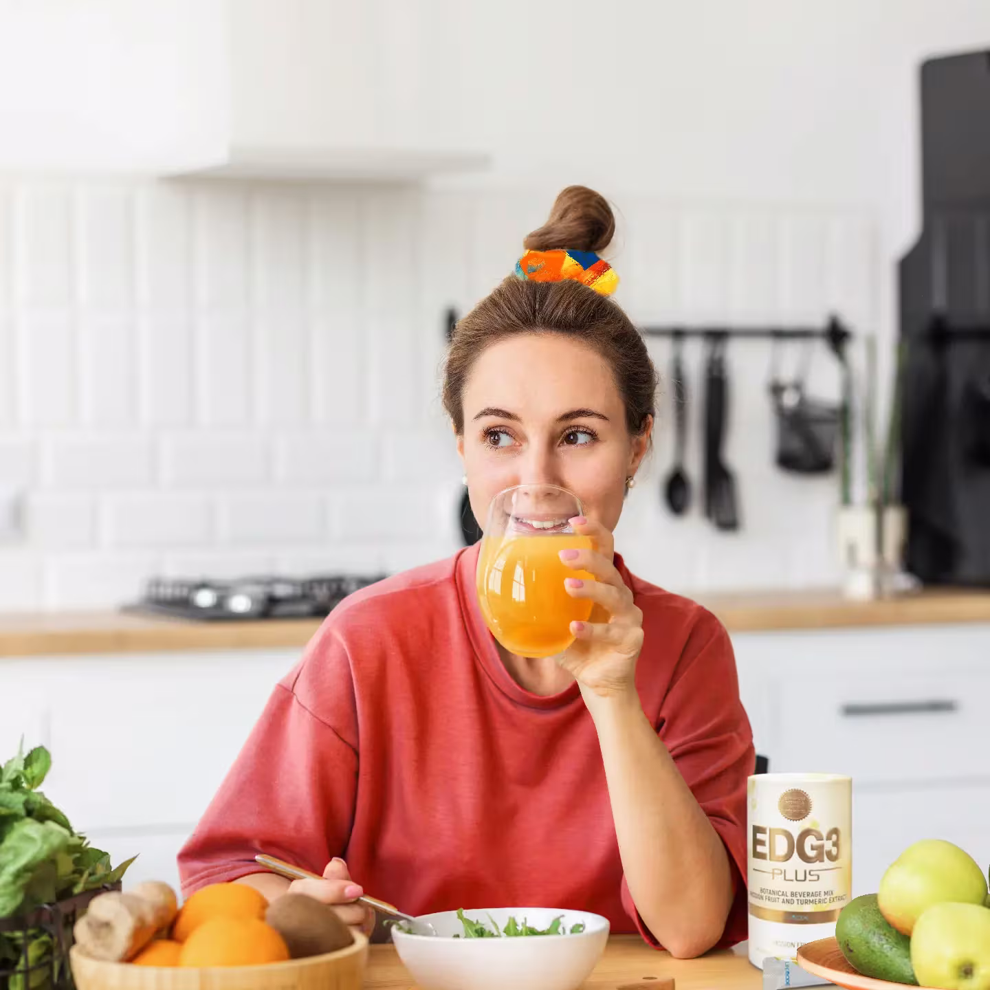 Girl drinking nutritious drink and eating a salad