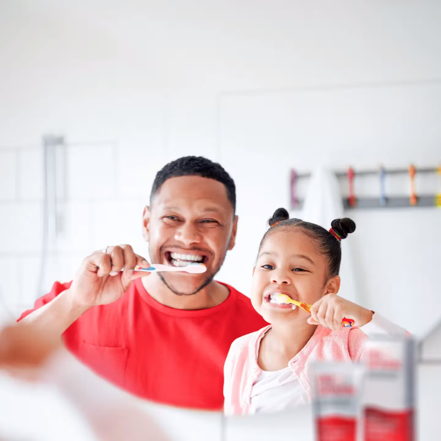 Championing Family: How Qnet Products Enhance Your And Your Loved Ones’ Wellness 4 Dad and daughter brushing their teeth with Prospark toothpaste, a QNET Product that is Championing Family health and wellness