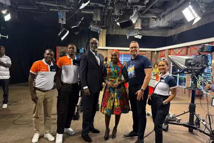 QNET in Ghana: Trevor Kuna, Biram Fall, and Vicky Ras pose with GTV presenter Maltiti Sayida Sadick